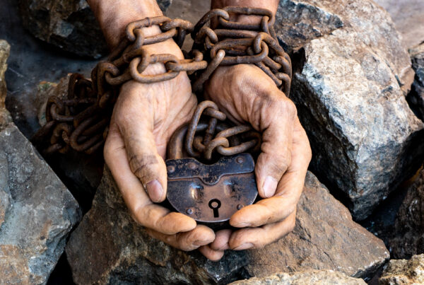 Hands of an employee in forced labour